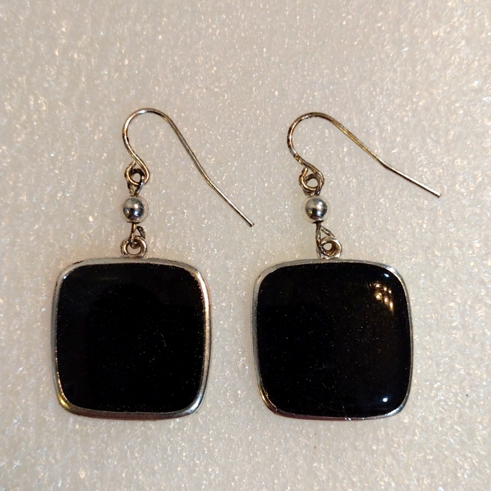KC dangling square shape earrings.